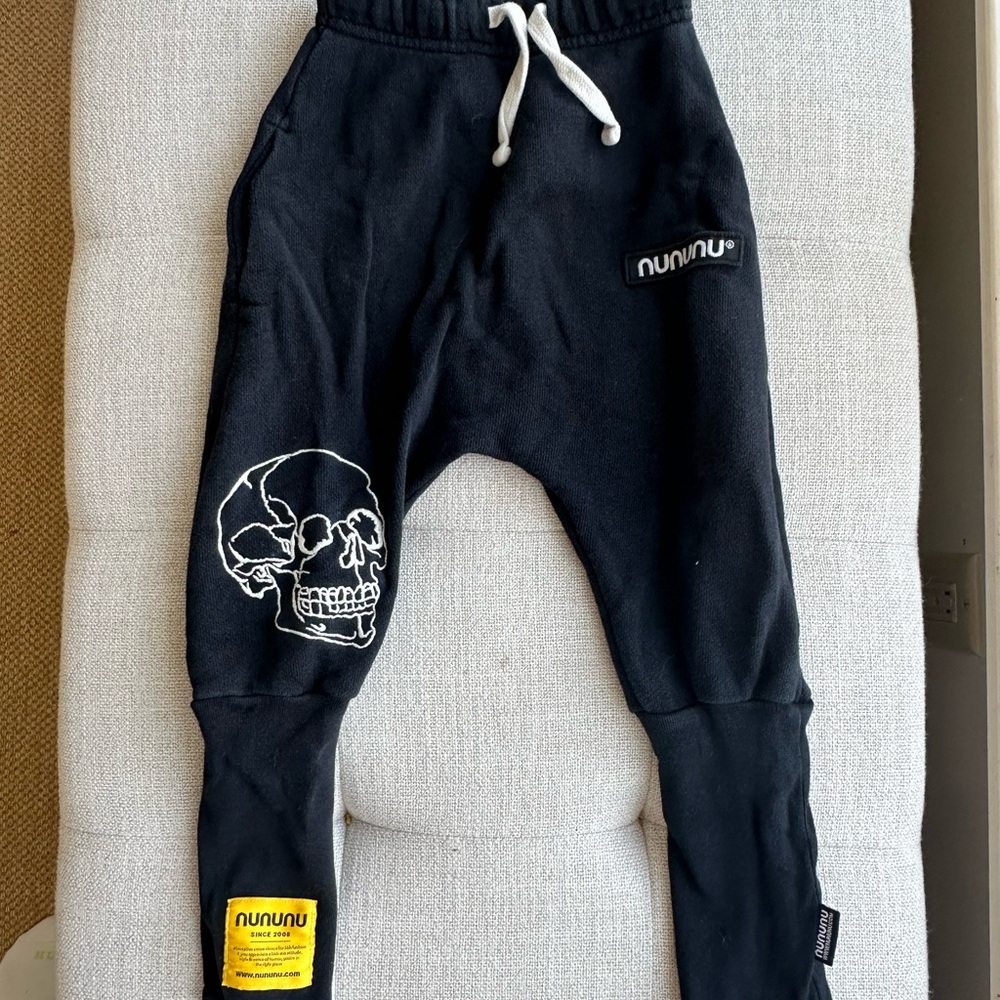 nununu Black Jogger Pants with White Skull Graphic